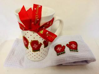 Ceramic Mug with Christmas Decorations and White Dishcloth