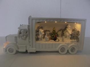 Camion Babbo Natale innevato con luci