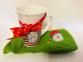 Ceramic Mug with Christmas Decorations and Green Dishcloth